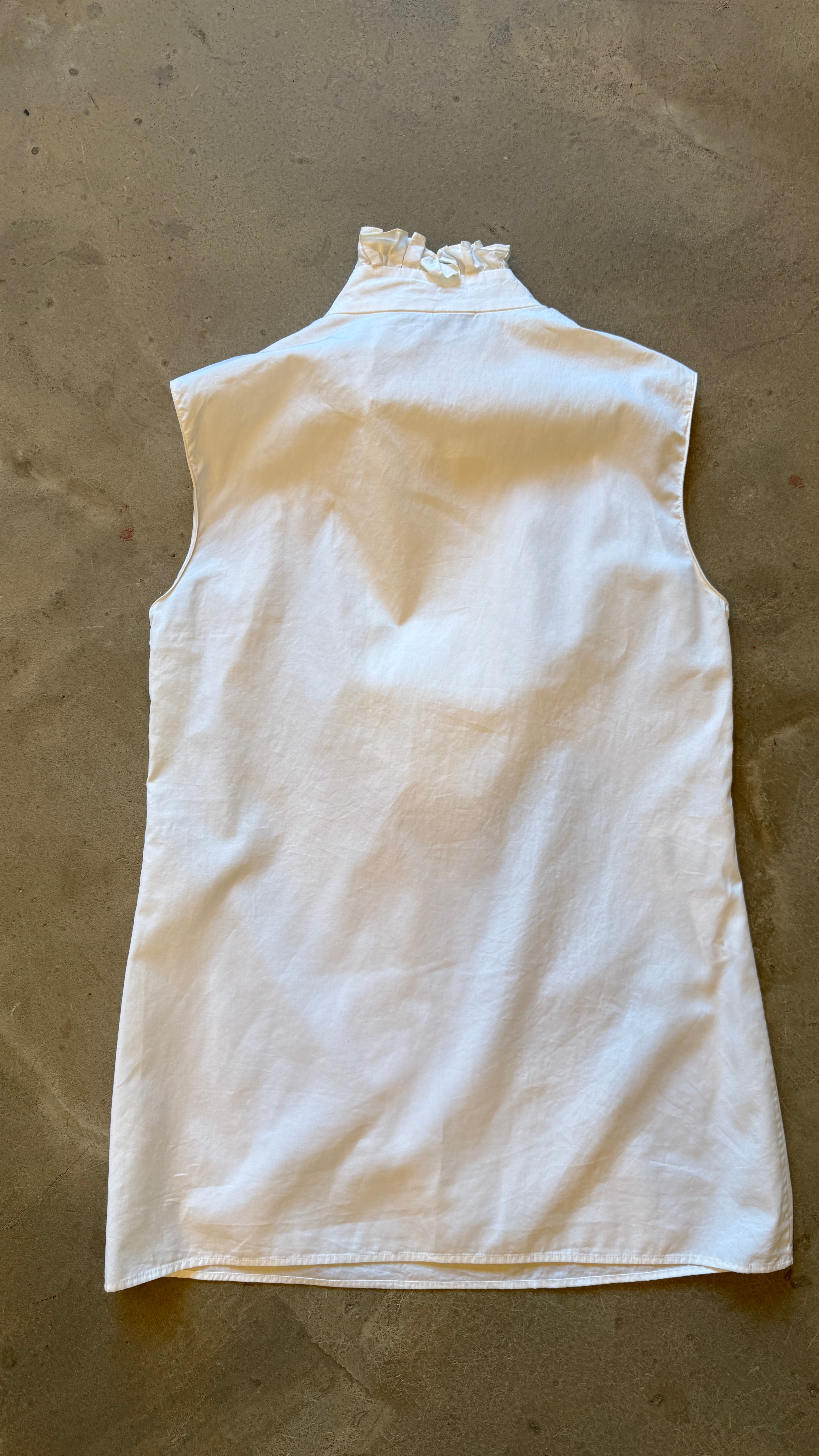 White Ruffle Sleeveless Blouse