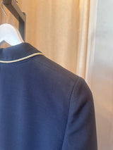 Blue blazer with white trim