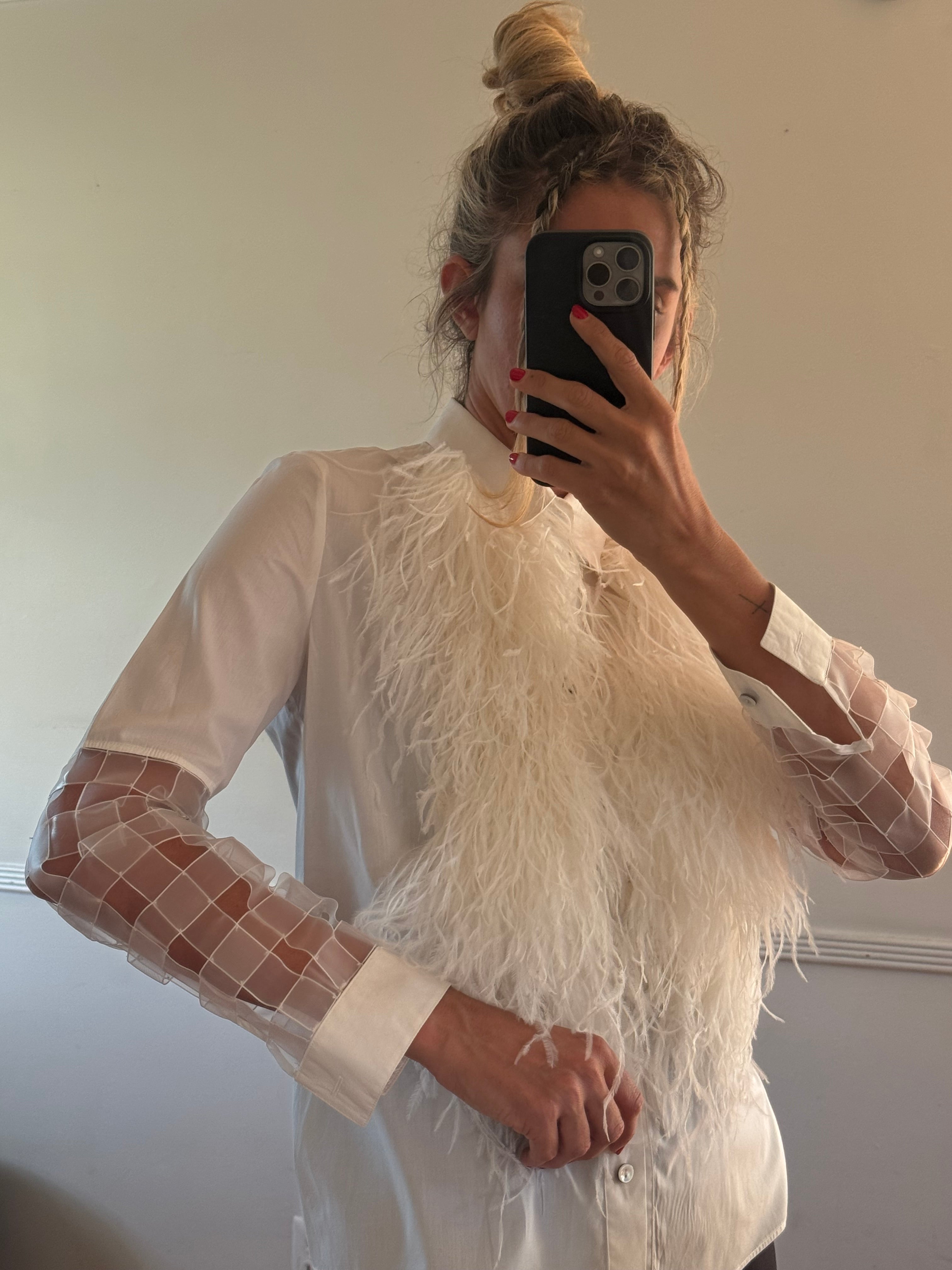 Shirt with feathers
