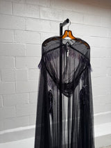 Cape with metallic fringe details
