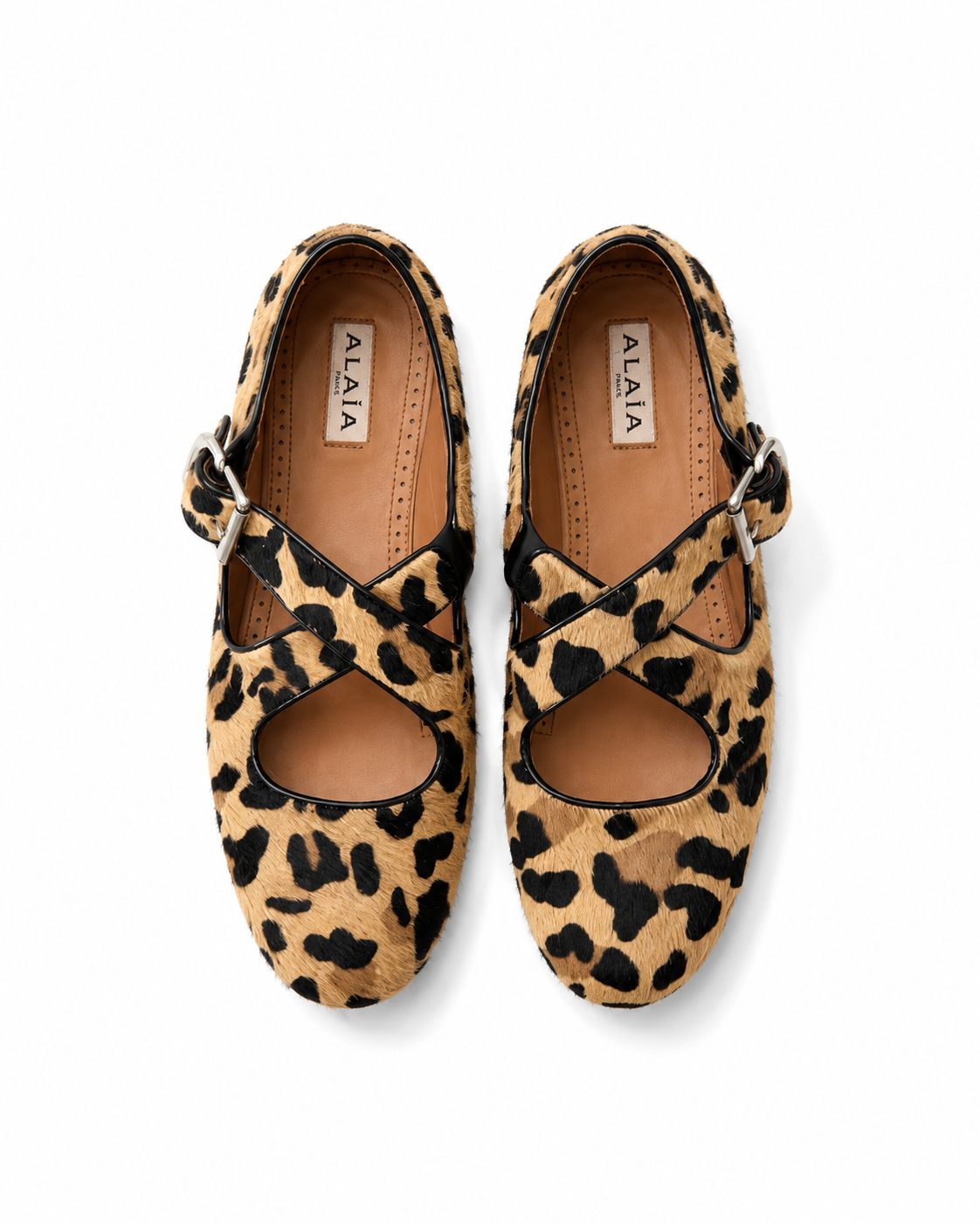 Shop vintage Alaïa Criss Cross flats in leopard-print calf hair with signature crossover straps and leather trim. Authentic designer footwear from Lulah Archive.