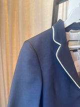 Blue blazer with white trim