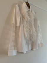 Shirt with feathers