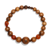 Wooden beaded bracelet with Chanel logo on a white background
