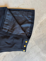 Flap skirt with gold buttons