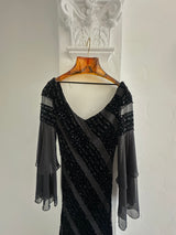 Elegant Black Evening Gown with Sheer Sleeves and Sequin Details