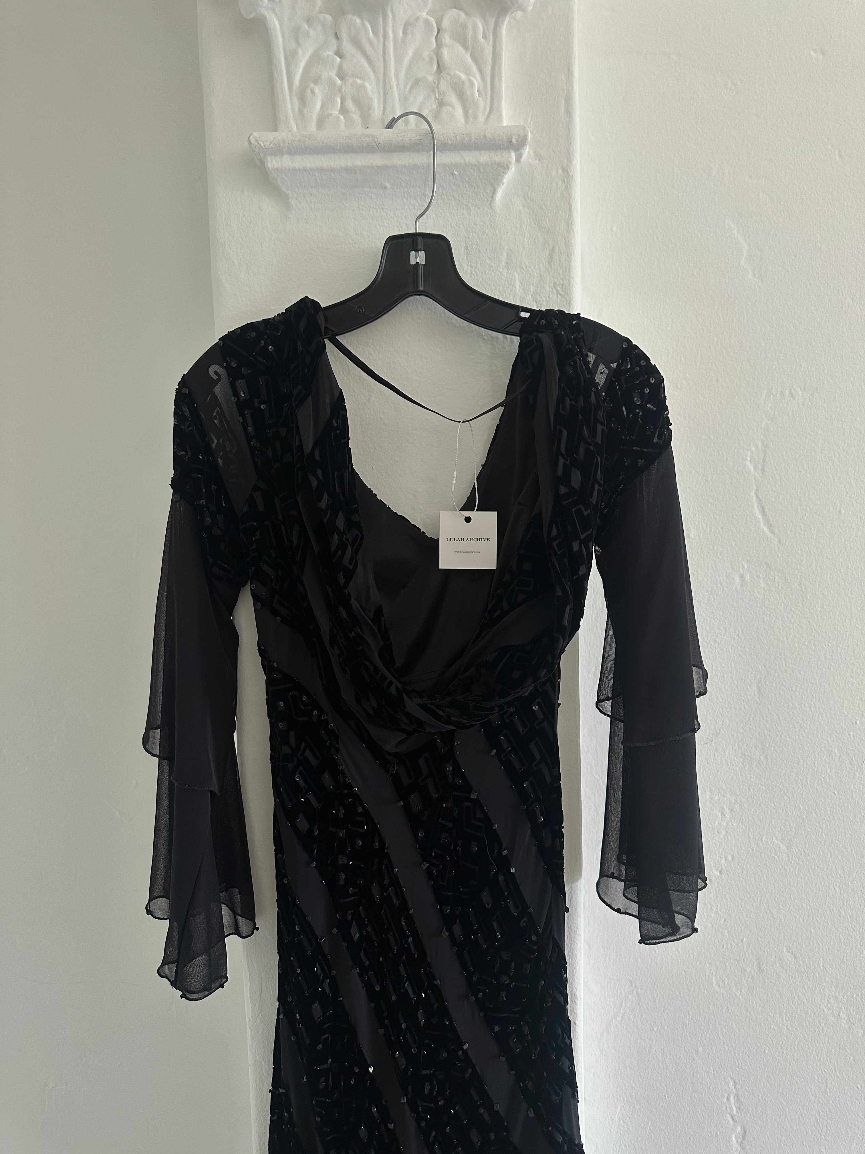 Elegant Black Evening Gown with Sheer Sleeves and Sequin Details